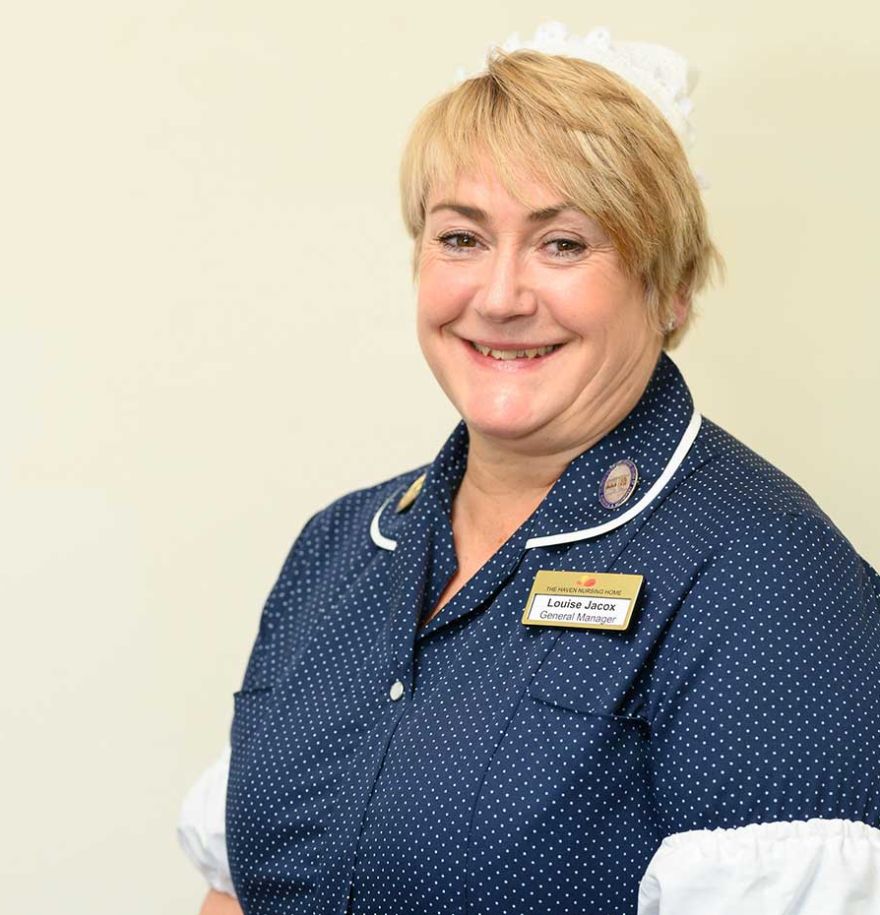 Headshot of a member of staff smiling.